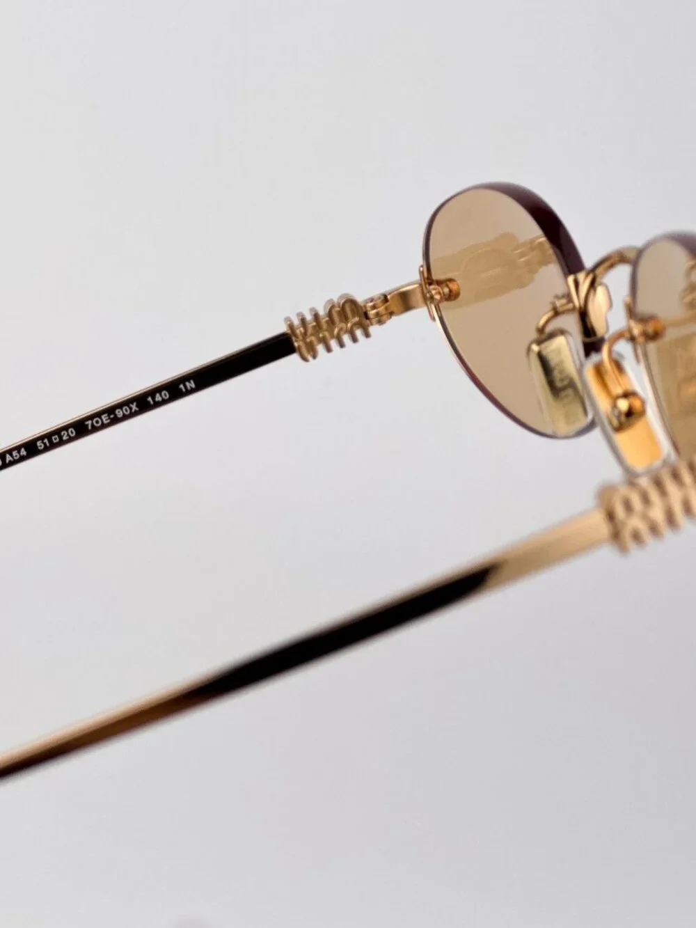 Miu Miu MUA54S 7OE90X Sunglasses – Brass Oval Rimless Metal Frame